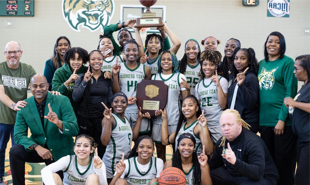 Lady Bobcat Basketball Team, coaches, support staff and EGSC President celebrate win